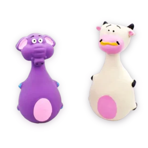 A white squeaky cow made by latex toy for dogs