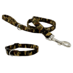 A happy dog on a walk wearing a military print dog leash and collar set